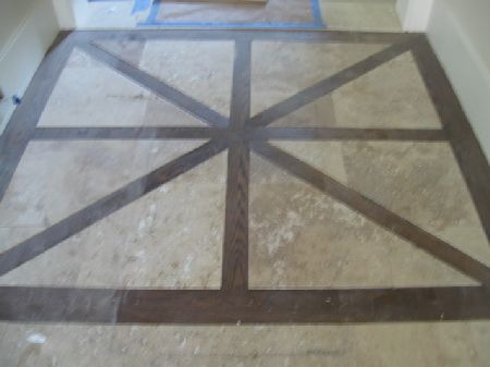 Historic parquet wood floor refinishing in Houston Antique parquet wood floor with a geometric border being refinished in a historic Houston home