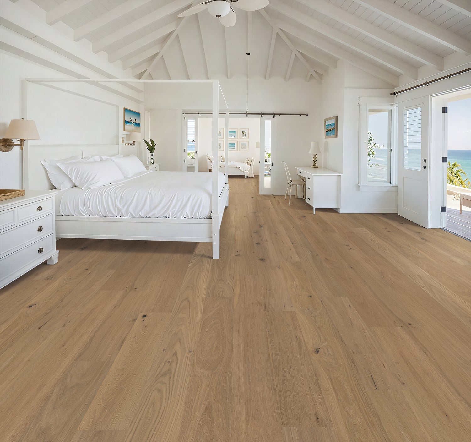 Smooth European white oak hardwood floor Bright white bedroom with smooth European white oak hardwood flooring and a vaulted white ceiling