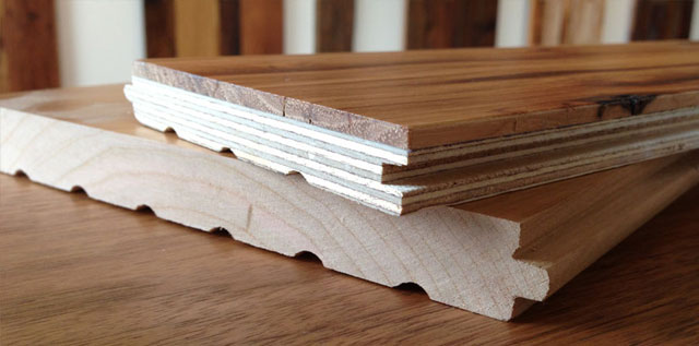 Solid and engineered hardwood flooring options Solid hardwood and engineered hardwood flooring plank cross-sections showing layered construction